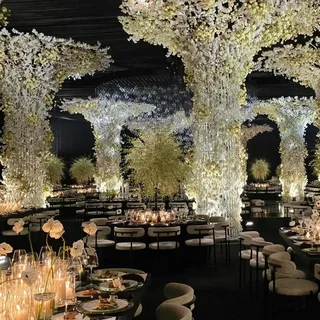 modern wedding decor trends 2026 with floral arch and elegant lighting