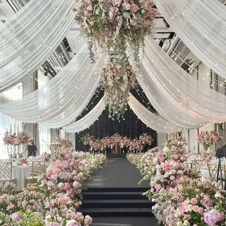 Wedding ceiling decoration with lights and drapes